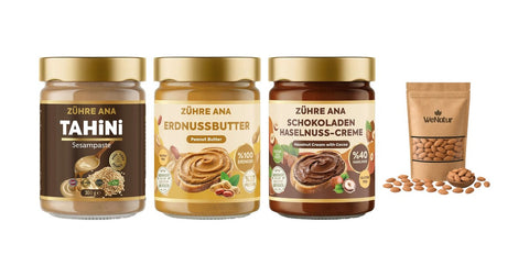 Tahin, Erdnussmus, Kakao-Haselnusscreme und rohe Mandeln für selbstgemachtes Mandelmus