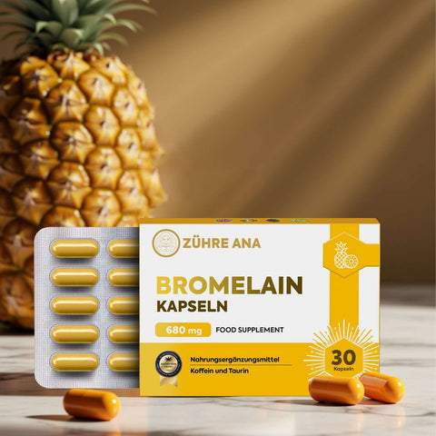 Zühre Ana Bromelain Kapsül ambalajı ve kapsülleri, ananas arka planında, besin takviyesi içerik bilgisiyle.